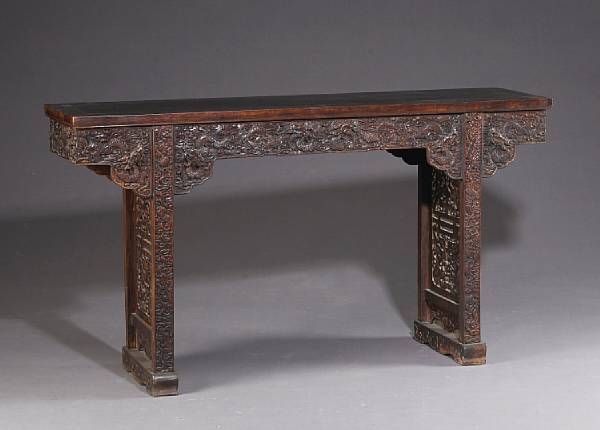 Appraisal: A Chinese mixed wood side table with carved and reticulated