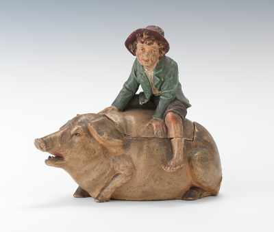 Appraisal: A Figural Tobacco Humidor of a Boy on a Sow's