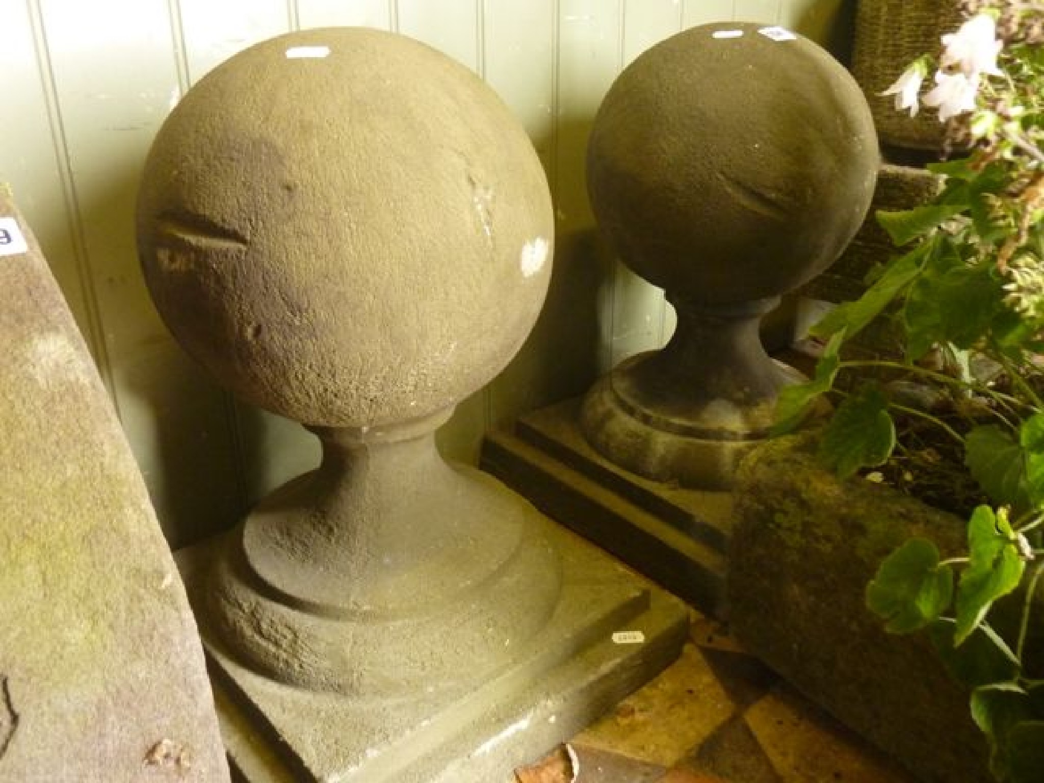 Appraisal: A pair of composition stone ball pillar caps with stepped