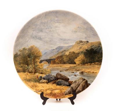 Appraisal: A Worcester wall plate depicting figures in a river landscape