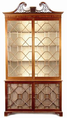 Appraisal: A mahogany bookcase cabinet in George III style the pierced