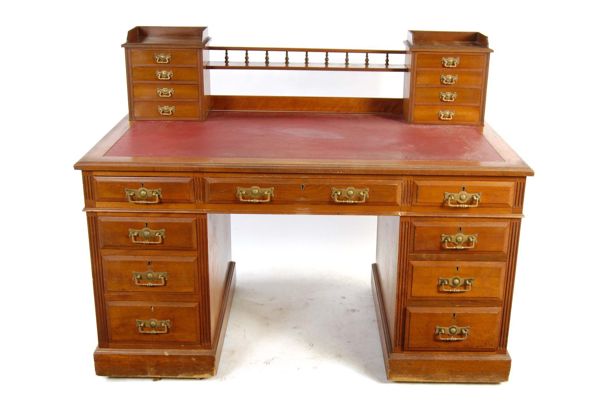 Appraisal: A late Victorian walnut twin pedestal desk