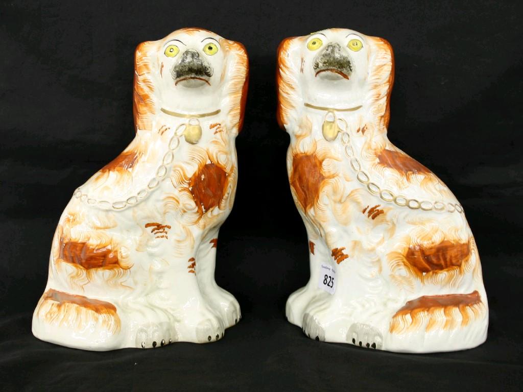 Appraisal: Pair of Staffordshire spaniels with rough coats and iron red