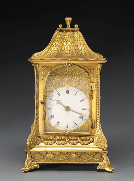 Appraisal: The engraved arched clock face with Roman and Arabic numeral