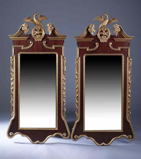 Appraisal: PAIR GEORGE II STYLE PARCEL-GILT MAHOGANY PIER MIRRORS Broken bonnet