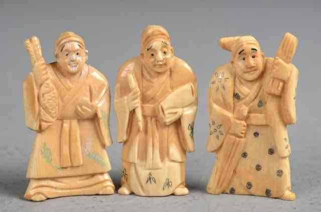 Appraisal: Japanese Carved Ivory NetsukeFinely carved to depict farmers tea stained