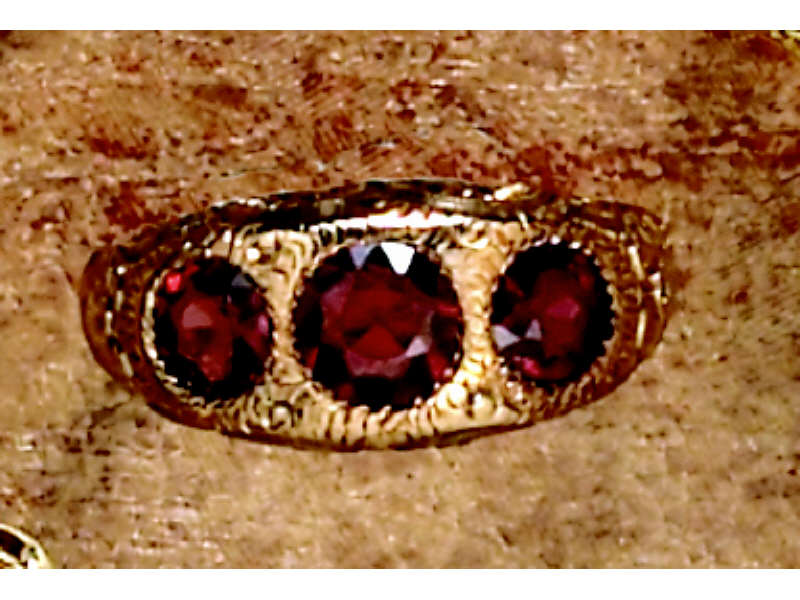 Appraisal: GARNET RING Rose gold heavily engraved ring with three bezel