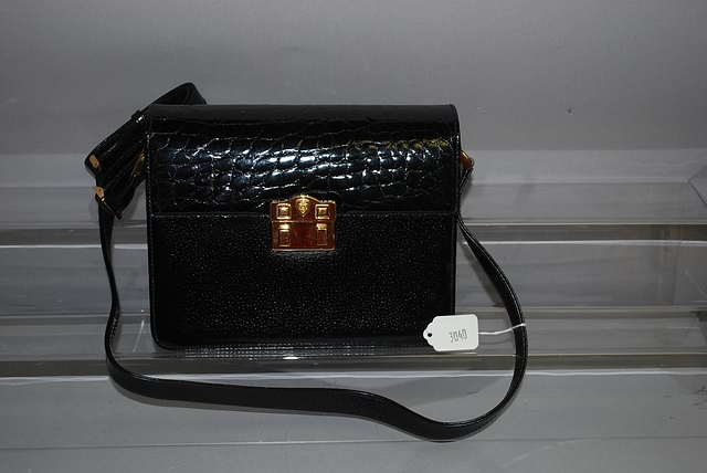 Appraisal: Gucci black leather handbag with shoulder strap and suede lining