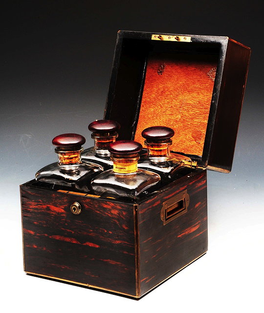 Appraisal: A TH CENTURY COROMANDEL WOOD DECANTER BOX with inset brass