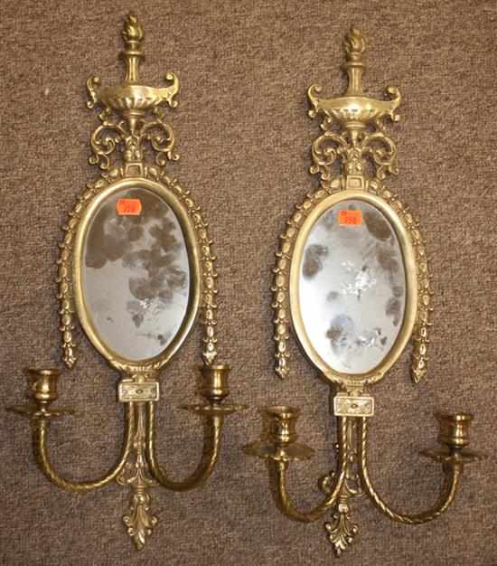 Appraisal: Pair of Regency style brass mirrored two-light wall sconces Estimate