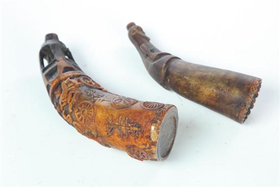 Appraisal: TWO POWDER HORNS Mexican or Indonesian th century The first