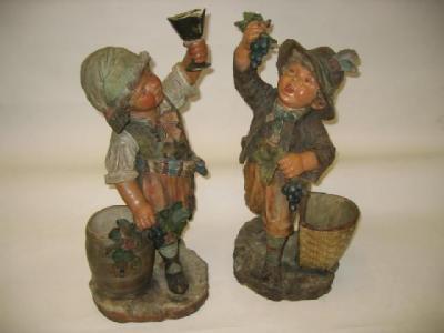 Appraisal: A PAIR OF CONTINENTAL POTTERY FIGURES early th century in