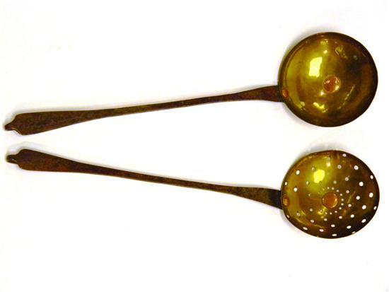 Appraisal: th C pair of wrought iron and brass utensils one