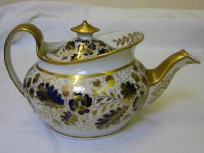 Appraisal: A NEW HALL PORCELAIN TEAPOT of boat form with gilt