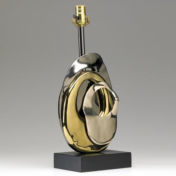 Appraisal: MODERN Patinated metal abstract lamp base on black enameled base