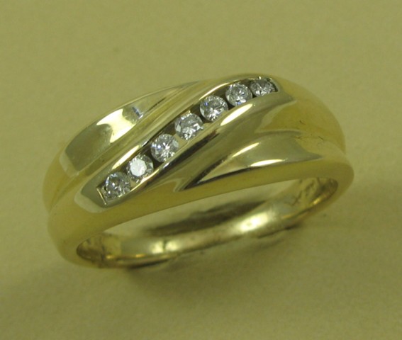 Appraisal: MAN'S DIAMOND AND FOURTEEN KARAT GOLD RING set with a