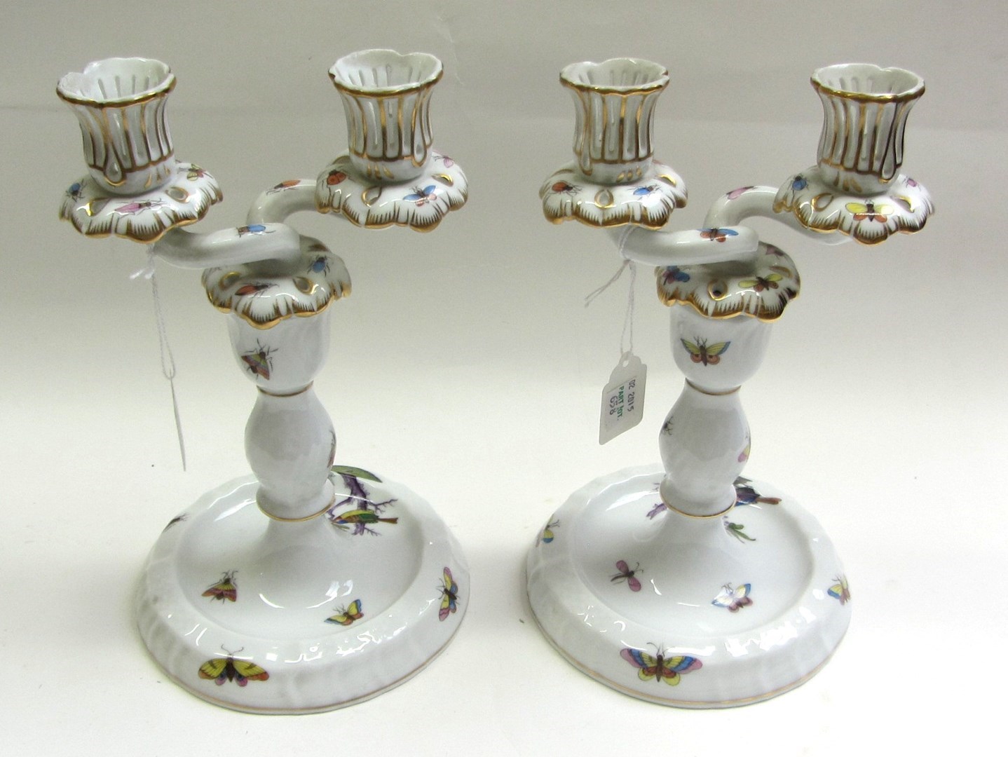 Appraisal: A pair of Herend porcelain two branch candlesticks th century