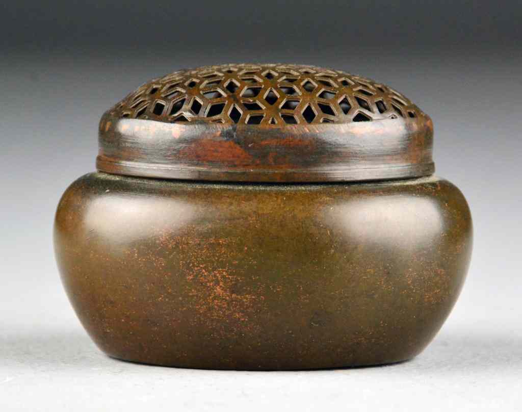 Appraisal: Chinese Bronze Handwarmer By Zhang Ming QiMiniature bronze hand warmer