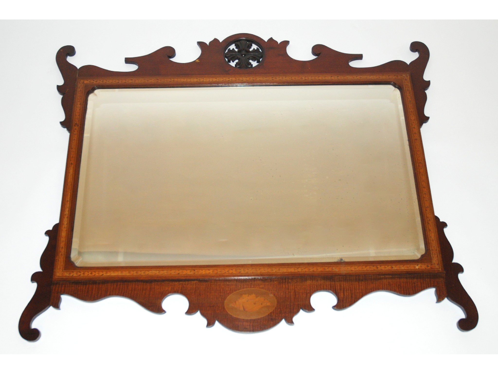 Appraisal: A Georgian style mahogany wall mirrorthe scroll shaped frame carved