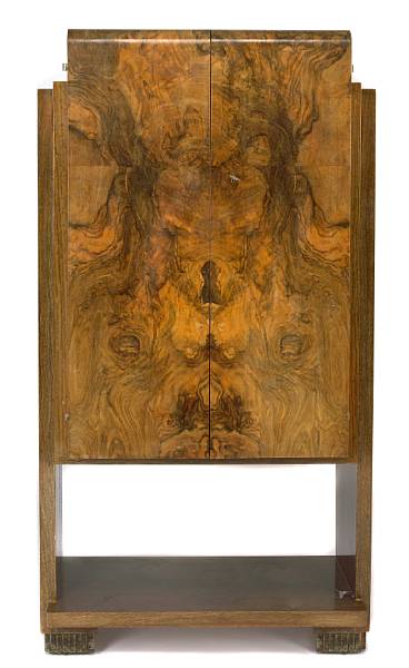 Appraisal: An Art Deco burled walnut cabinet s shelved interior height