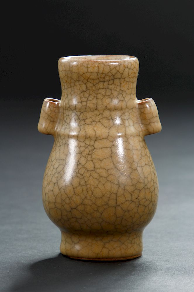 Appraisal: Crackle Glazed 'Hu' Bottle Vase The flattened pear-shaped body carved