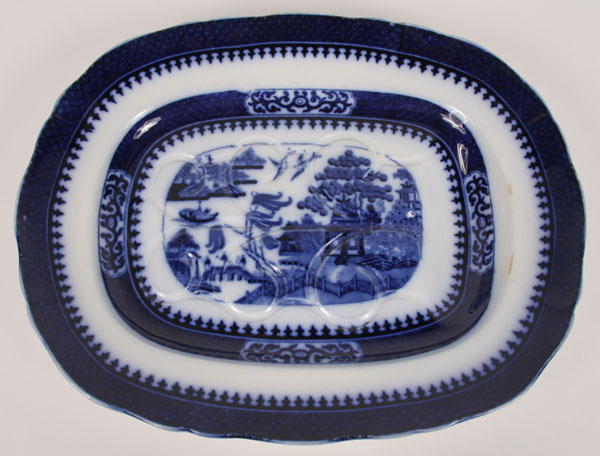 Appraisal: Large Flow Blue Minton Boyle footed meat platter with reservoir