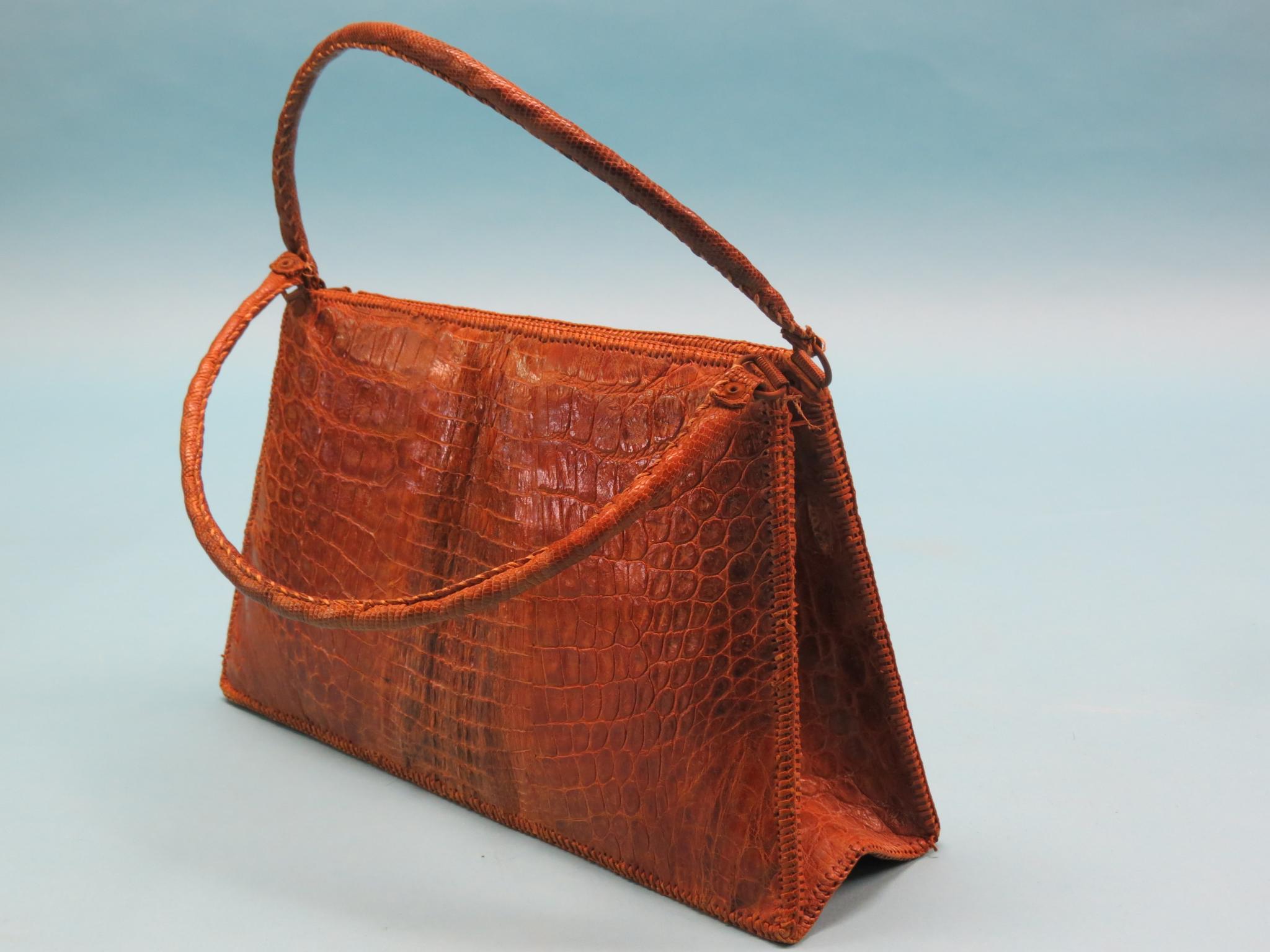 Appraisal: A lady's alligator skin evening bag in wide