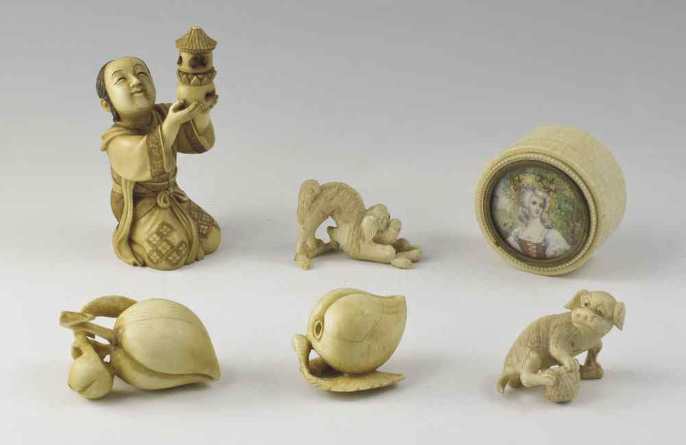 Appraisal: PIECE COLLECTION OF CARVED IVORY To include Figure holding lantern