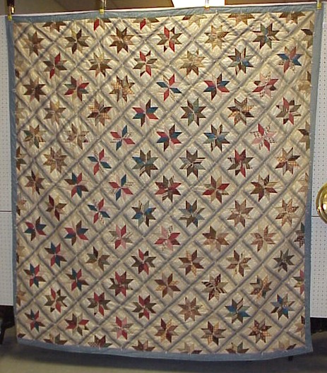 Appraisal: Pieced cotton patchwork quilt eight point multicolor stars inside of