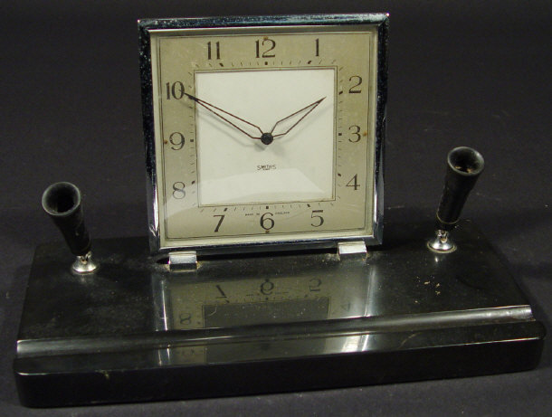 Appraisal: Art Deco Smiths eight day desk clock mounted onto a