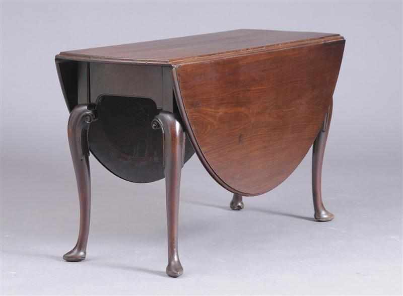 Appraisal: GEORGE II CARVED MAHOGANY GATE-LEG TABLE With bowed ends and