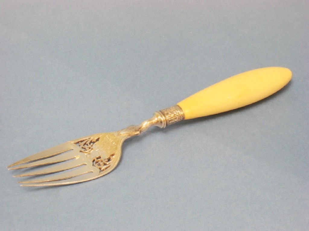 Appraisal: A Victorian Serving Fork with engraved and pierced blade and