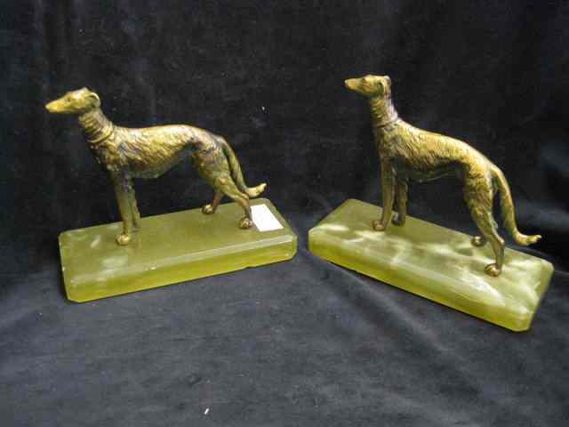 Appraisal: Pair of Bronzed Dog Bookends onyx bases '' deco era