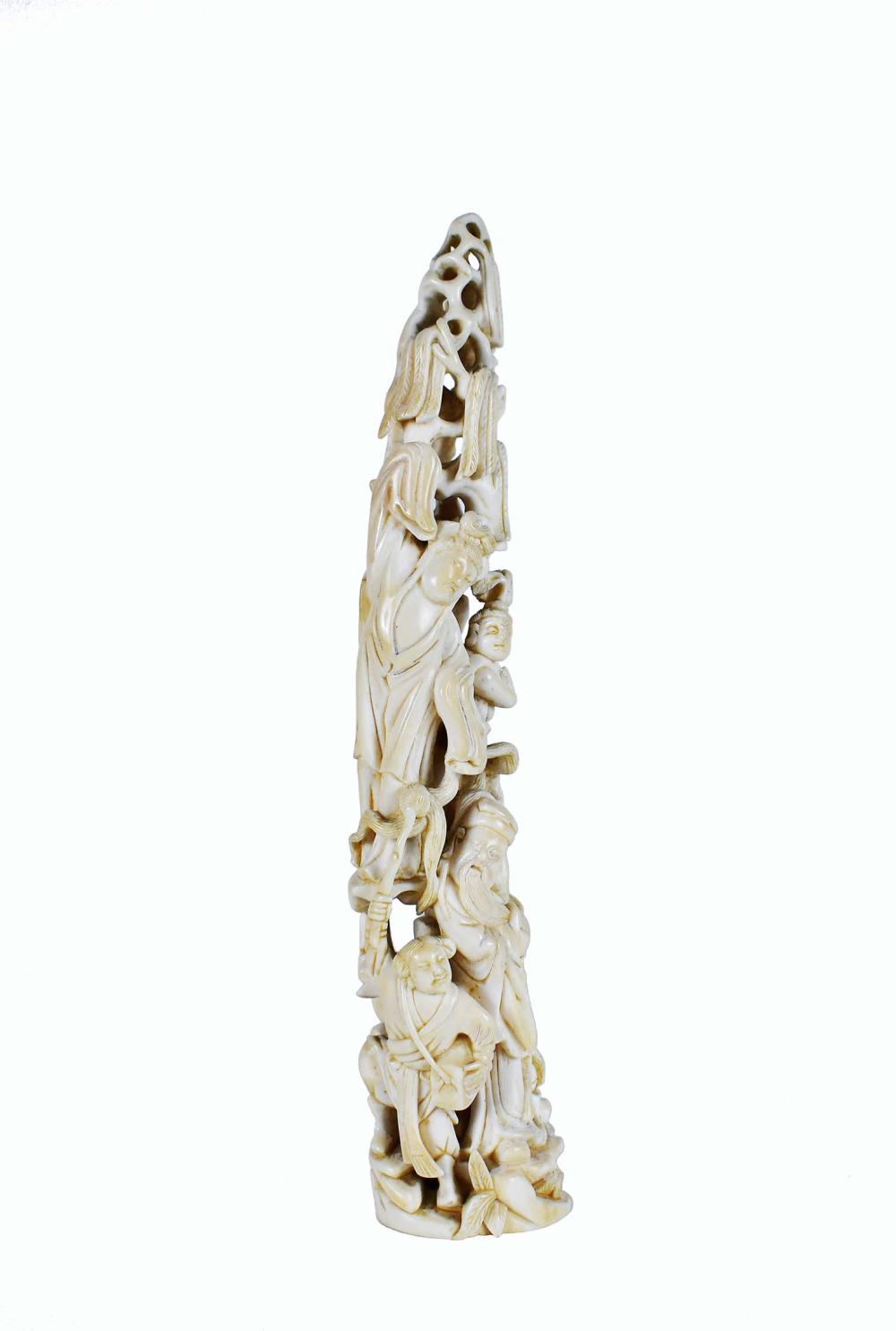 Appraisal: CHINESE TUSK-FORM FIGURAL CARVINGCarved with four ascending immortals Height in