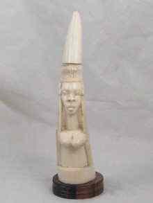 Appraisal: An ivory fertility carving of a woman probably African cm