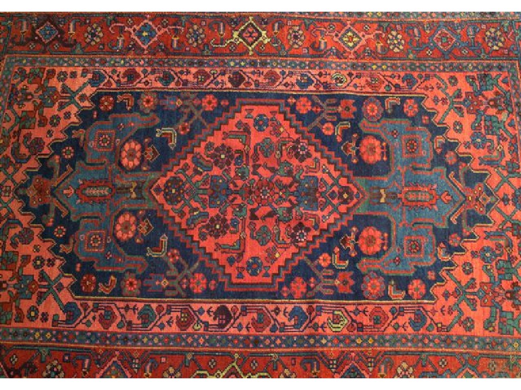 Appraisal: KURDISH RUG the central medallion with a deep pink ground