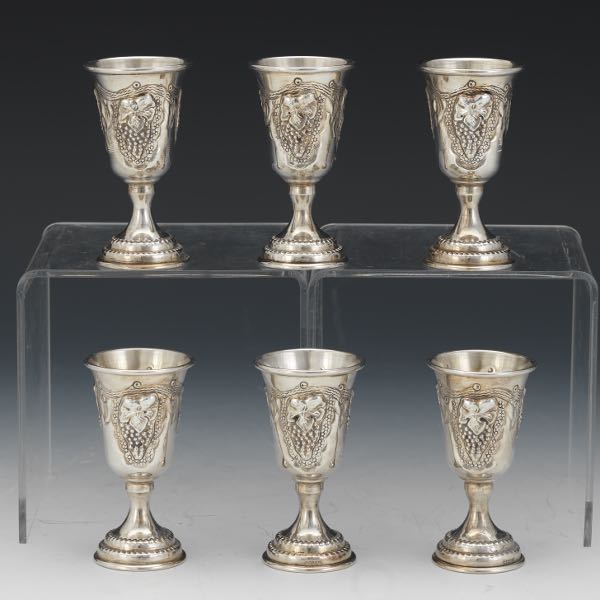 Appraisal: SIX STERLING SILVER SHOT GLASSES WITH GRAPE DESIGN Six bell