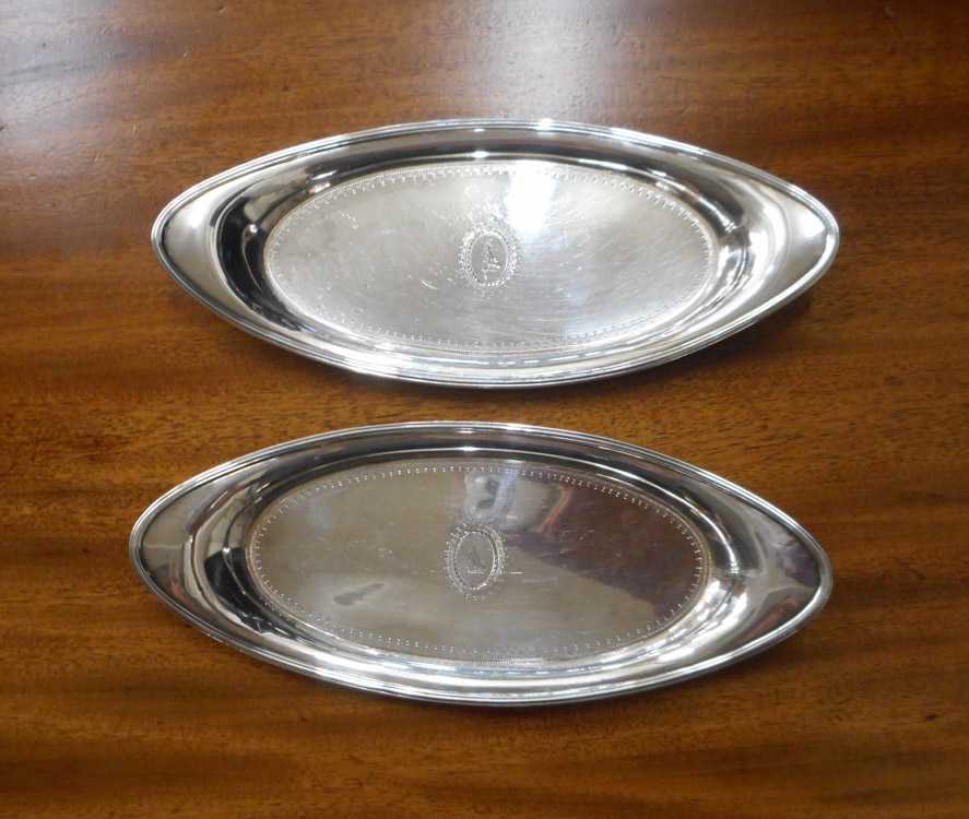 Appraisal: PAIR KING GEORGE III STERLING SILVER TRAYS hallmarked London Length