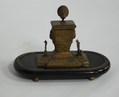 Appraisal: A gilt metal mounted inkstand the inkwell with peacock finial