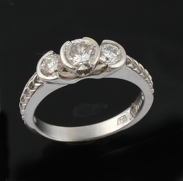 Appraisal: A three stone diamond ring The principal round brilliant cut