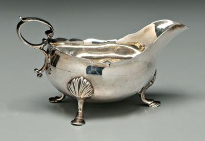 Appraisal: George III silver gravy pitcher oval with wave rim leaf-capped