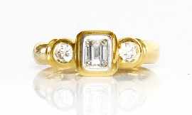 Appraisal: An ct gold round brilliant and emerald cut diamond ring