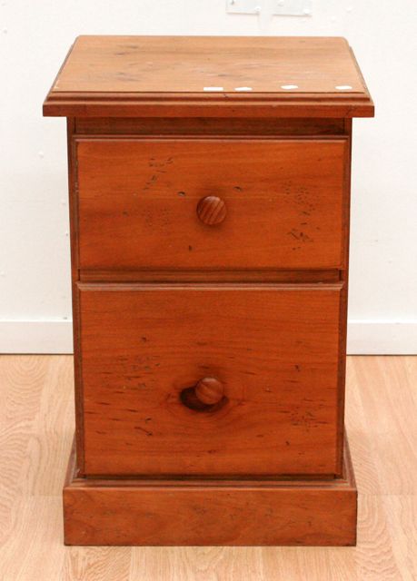 Appraisal: A small pine two drawer bedside chest