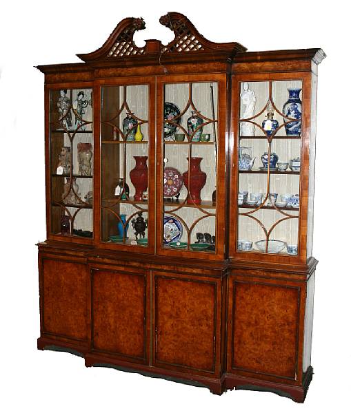 Appraisal: A George III style walnut breakfront display cabinet with pierced