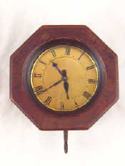 Appraisal: An unusual nickel plated brass alarm clock in octagonal mahogany