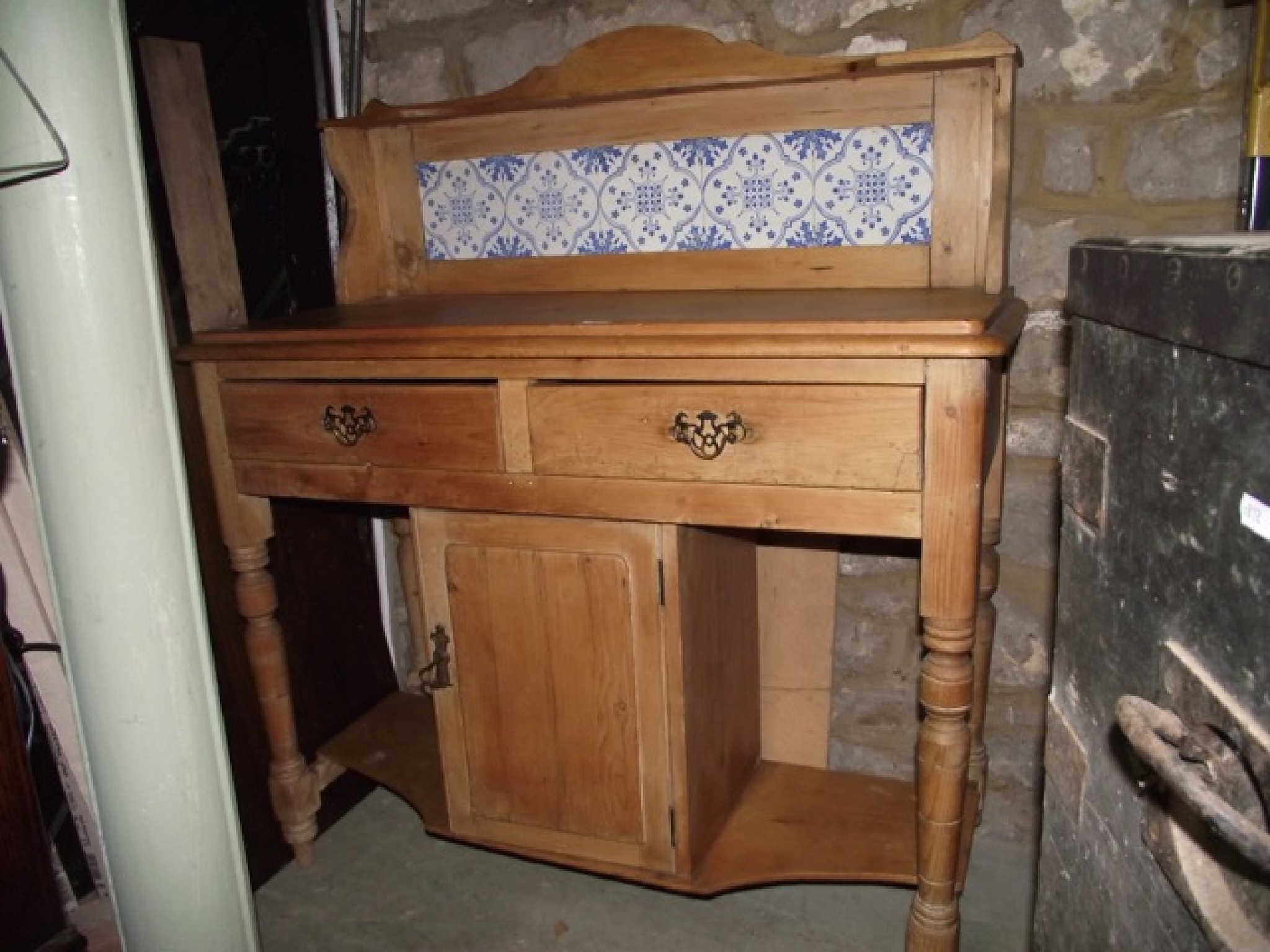 Appraisal: A late Victorian stripped pine wash stand the raised back