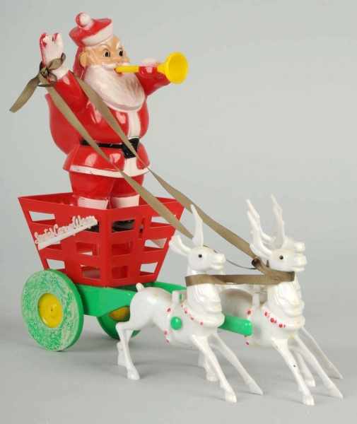 Appraisal: Plastic Santa Candy Wagon Description On wheels and pulled by