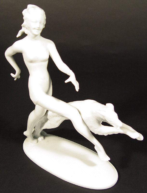 Appraisal: Art Deco china figurine a woman and leaping hound decorated