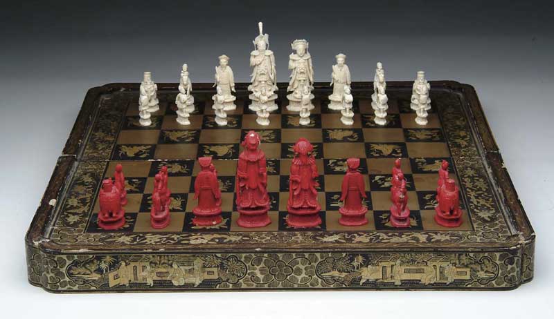 Appraisal: ORIENTAL LACQUER FOLDING CHESSBOARD WITH CARVED BONE FIGURES Folding lacquer