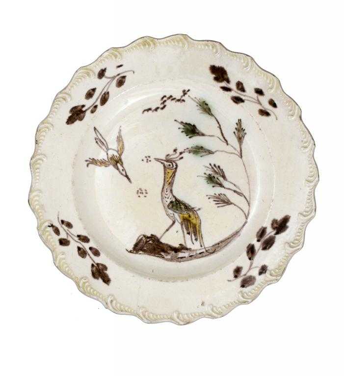 Appraisal: A YORKSHIRE CREAMWARE PLATE ATTRIBUTED TO ROTHWELL painted in manganese